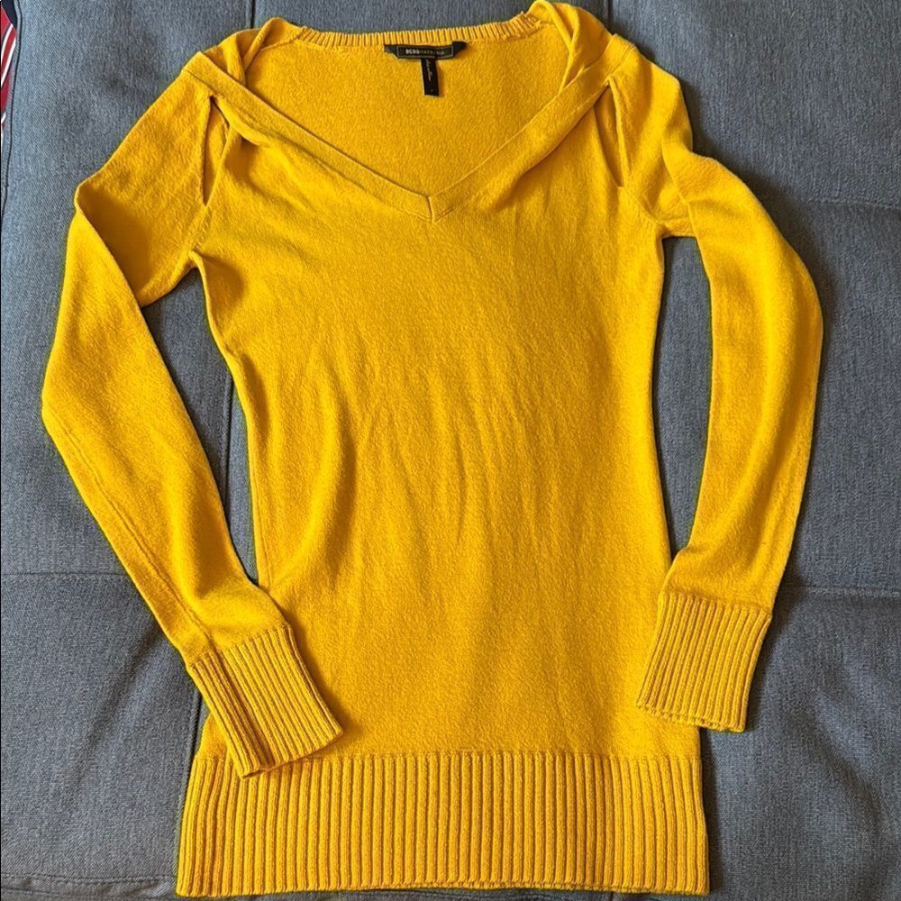 BCBGMaxAzaria Woman’s Cotton V Neck Long Sleeve Open Shoulder Sweater in Honey.